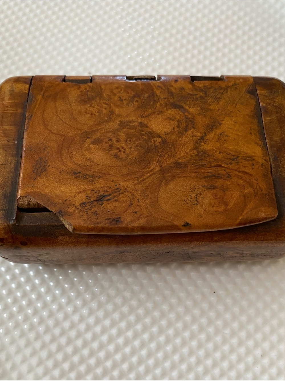 An antique burr wood pocket snuff box with figured grain